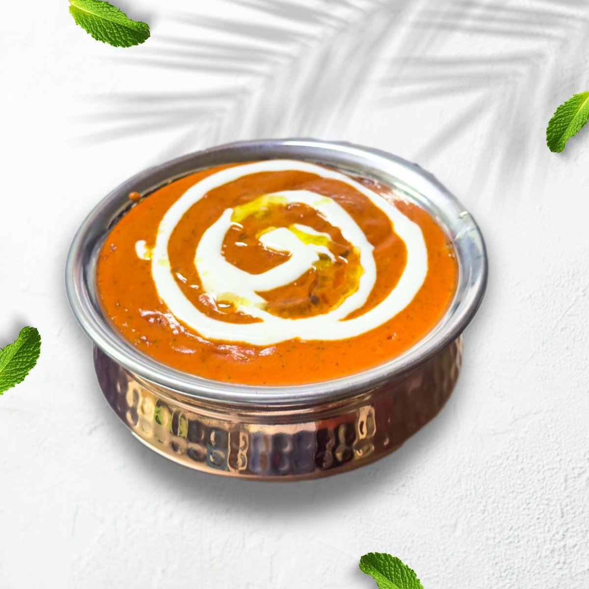 Butter chicken in a copper bowl