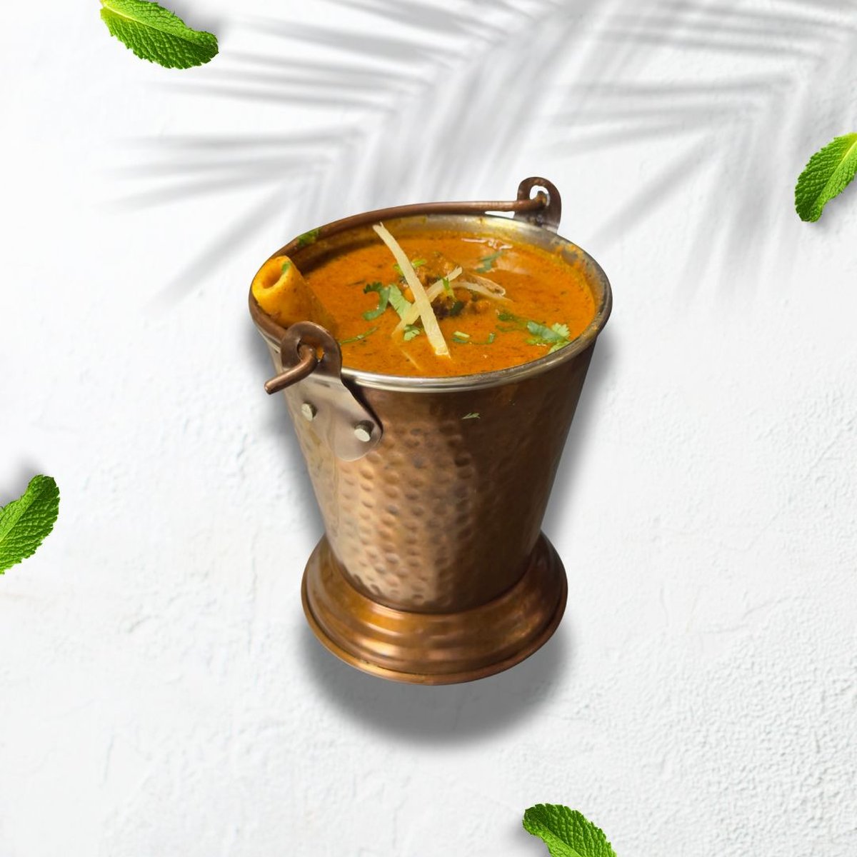 Mutton curry served in a traditional bowl