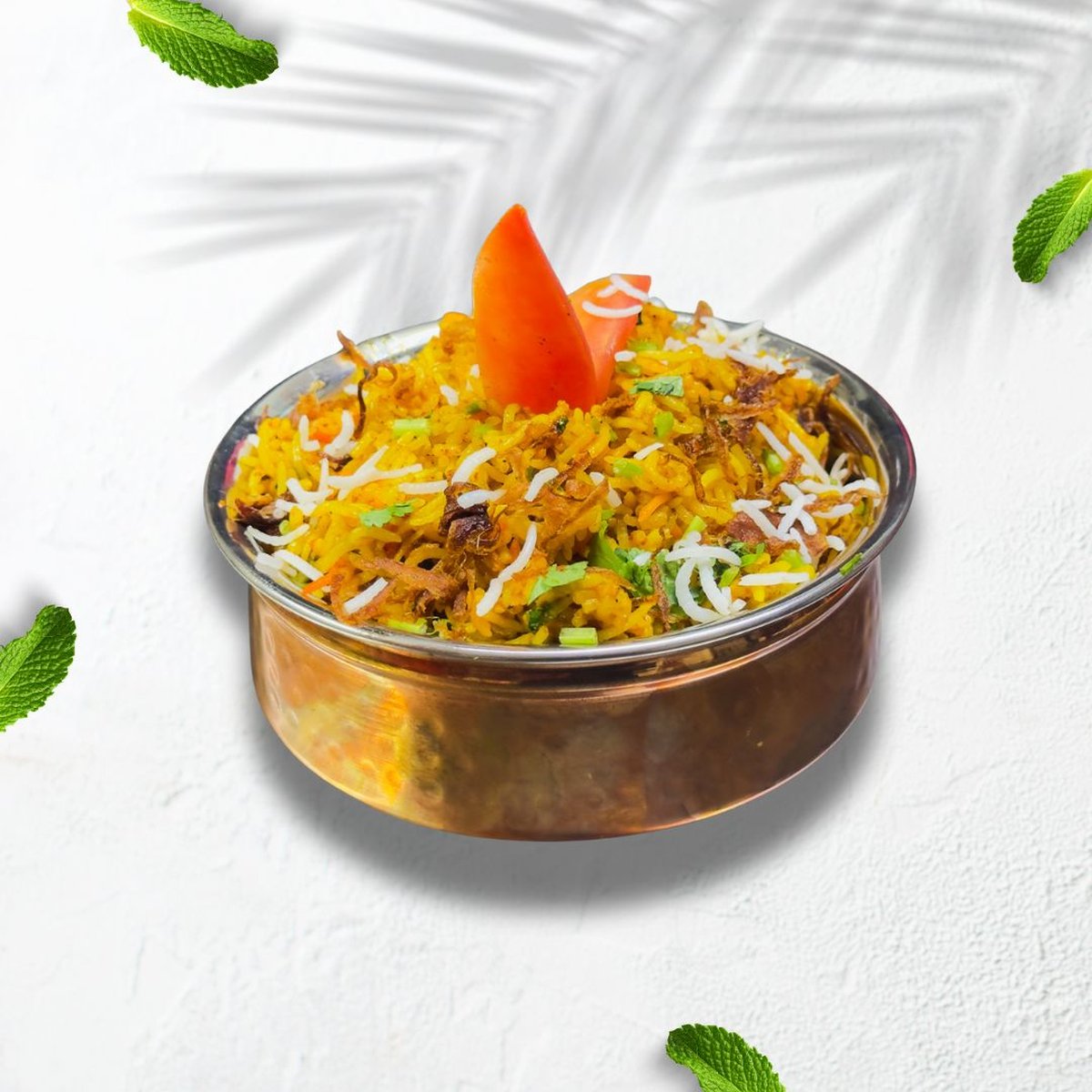 Chicken biryani served in a copper bowl